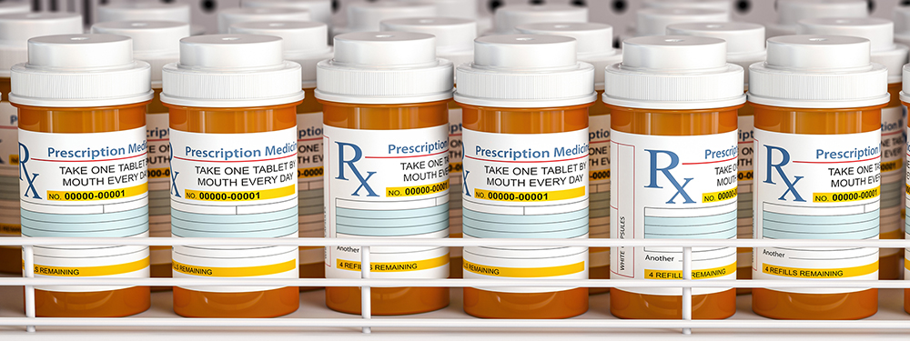 Medicare Prescription Payment Plan Can Help You Manage Monthly Drug Costs Row of drug bottles and pill tablet box on the farmacy shelf.