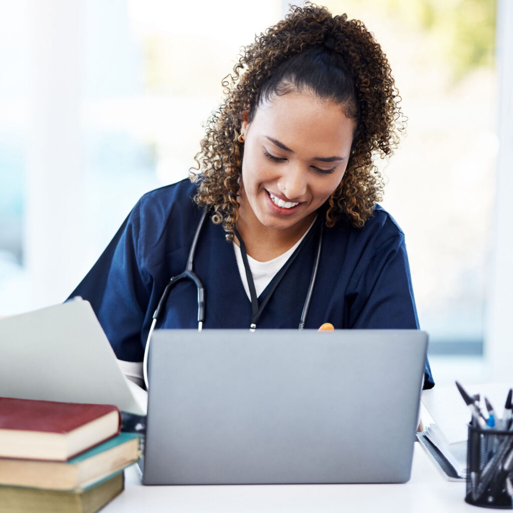 PHA Launches Certificate for Advance Practice Providers Woman, laptop or medical student books for research, education studying or college learning in university hospital. Smile, happy or healthcare nurse with technology in scholarship medicine internship