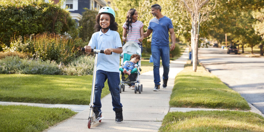 PHA’s 6-Minute Challenge Raises $7K Couple Push Daughter In Stroller As Son Rides Scooter