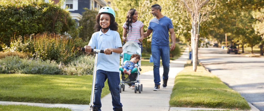 PHA’s 6-Minute Challenge Raises $7K Couple Push Daughter In Stroller As Son Rides Scooter